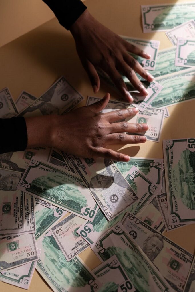 Image of dollar bills on a desk showcasing hard money loans for business needs